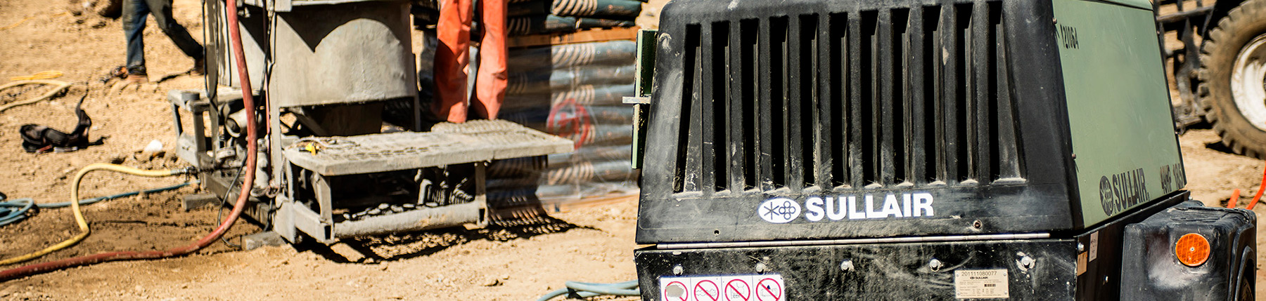 Sullair 185 air compressor on a job site
