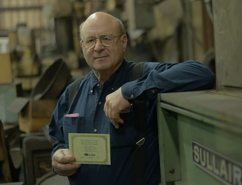 Gerry Bauer with his Sullair air compressor